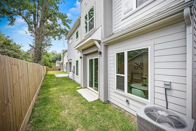 861 Prosper St, Houston, TX 77088 - view of home's exterior with a yard, central AC unit, and fence