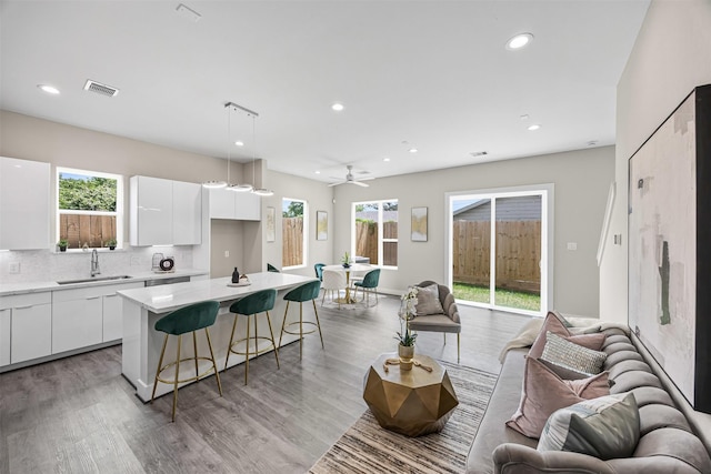 861 Prosper St, Houston, TX 77088 - kitchen with a sink, open floor plan, visible vents, a kitchen bar, and modern cabinets