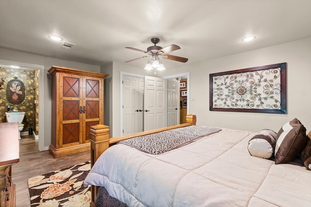 bedroom with a ceiling fan, wood finished floors, a closet, baseboards, and visible vents