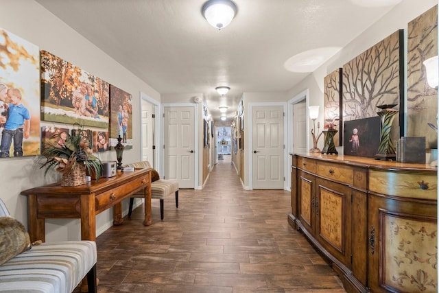 hall with dark wood-type flooring