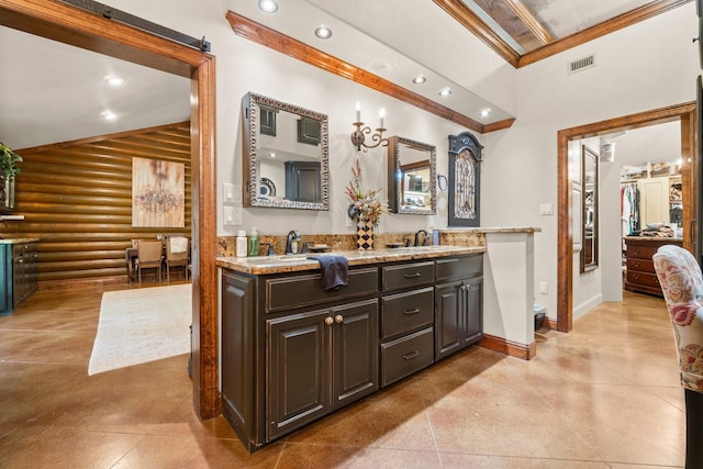 bathroom with double vanity, baseboards, visible vents, recessed lighting, and log walls