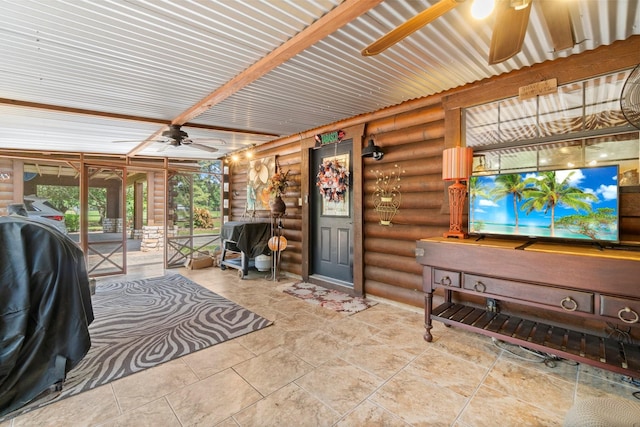 sunroom / solarium featuring french doors