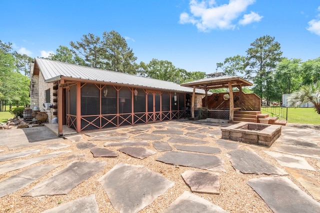 exterior space with an outdoor fire pit