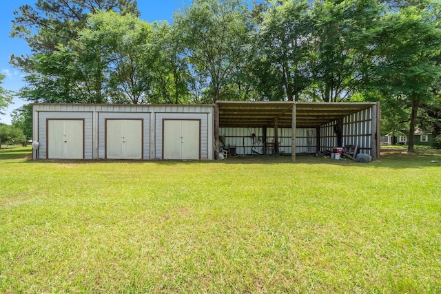 view of pole building featuring a detached carport and a lawn
