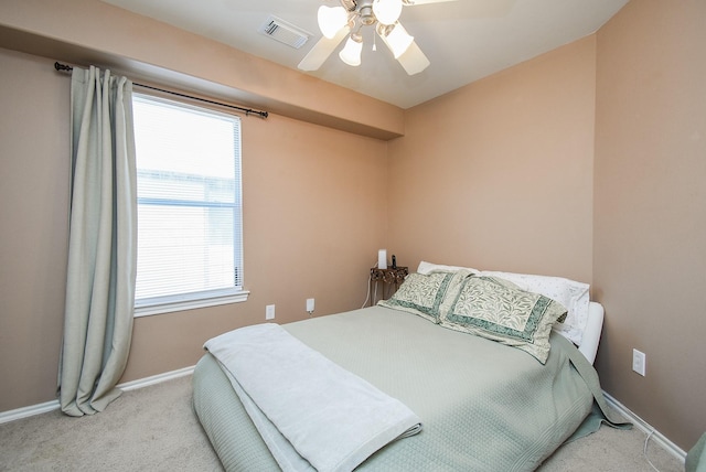 14418 Birch Knoll Ln, Houston, TX 77047 - carpeted bedroom with baseboards and ceiling fan