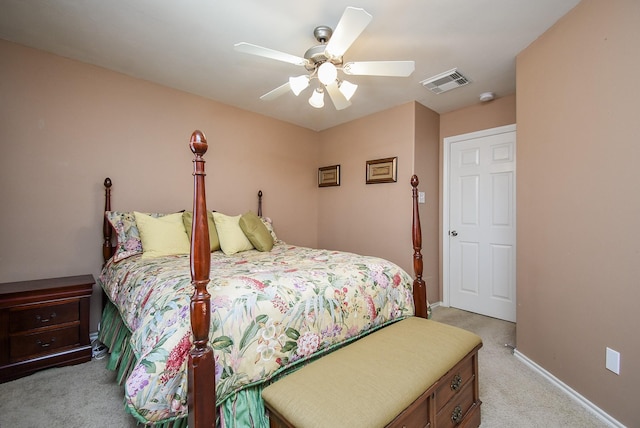 bedroom featuring ceiling fan, visible vents, light carpet, and baseboards