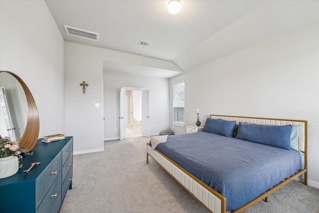 bedroom featuring light colored carpet, visible vents, and baseboards