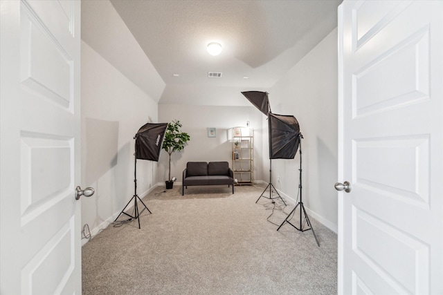 sitting room featuring visible vents, carpet floors, and baseboards