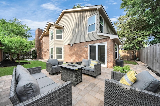 14110 Withersdale Dr, Houston, TX 77077 - fenced backyard featuring an outdoor living space with a fire pit and a patio