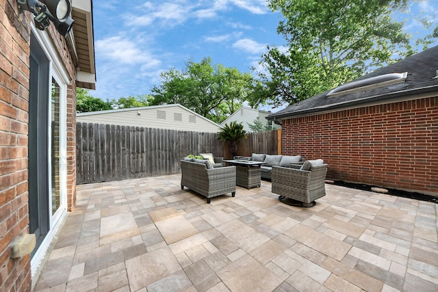 view of patio featuring a fenced backyard and an outdoor living space