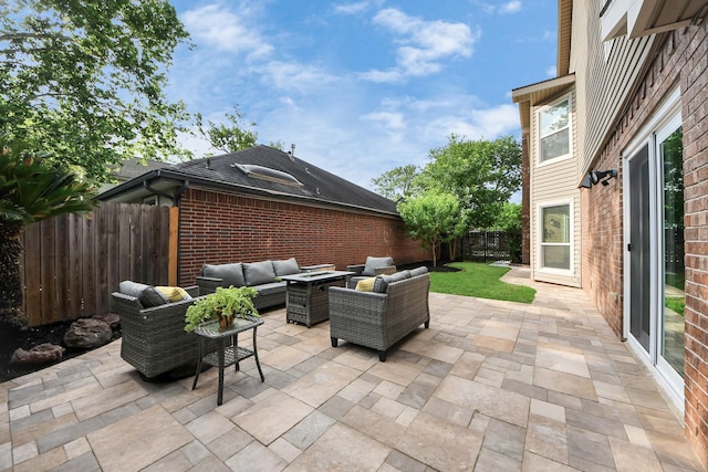view of patio / terrace with an outdoor living space and a fenced backyard