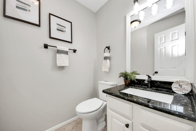 half bath featuring toilet, tile patterned floors, baseboards, and vanity