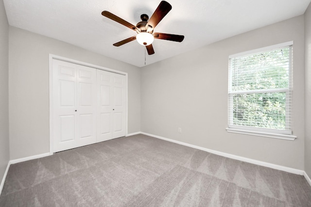 14110 Withersdale Dr, Houston, TX 77077 - unfurnished bedroom featuring carpet, baseboards, a closet, and ceiling fan