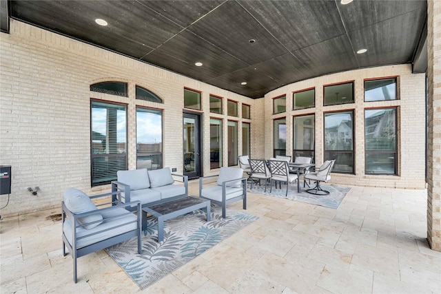 view of patio with outdoor lounge area and outdoor dining area