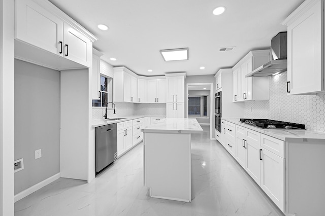 kitchen with a sink, marble finish floor, stainless steel appliances, visible vents, and recessed lighting