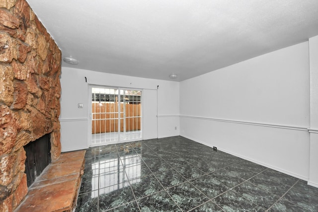 7954 Grove Ridge Dr, Houston, TX 77061 - empty room with baseboards and a fireplace