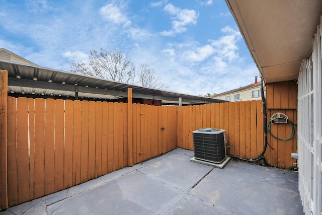7954 Grove Ridge Dr, Houston, TX 77061 - view of patio / terrace featuring central air condition unit and fence