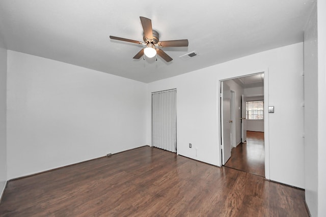 7954 Grove Ridge Dr, Houston, TX 77061 - unfurnished bedroom with wood finished floors, visible vents, a ceiling fan, a closet, and attic access