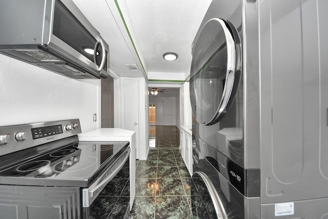 7954 Grove Ridge Dr, Houston, TX 77061 - washroom with stacked washer / drying machine, marble finish floor, laundry area, and visible vents