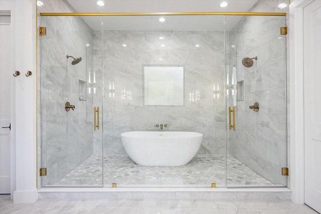 4016 Branard St, Houston, TX 77027 - bathroom featuring marble finish floor, a soaking tub, a marble finish shower, and recessed lighting