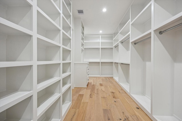 4016 Branard St, Houston, TX 77027 - walk in closet with light wood-style floors and visible vents