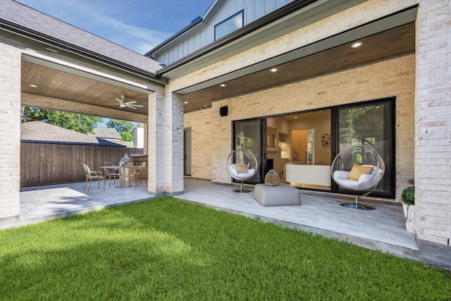 4016 Branard St, Houston, TX 77027 - exterior space with fence, brick siding, ceiling fan, board and batten siding, and a patio