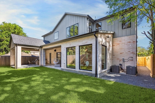 4016 Branard St, Houston, TX 77027 - back of house with central AC unit, brick siding, a patio area, and board and batten siding