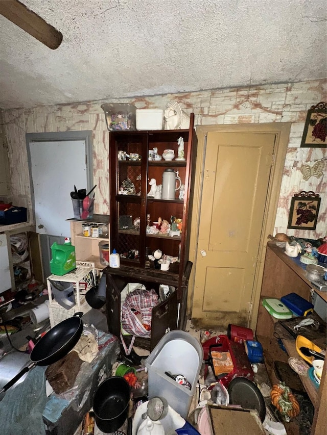 miscellaneous room featuring a textured ceiling