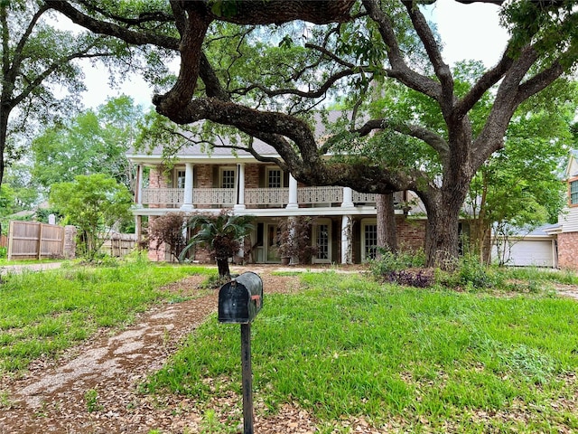 view of front of home featuring fence