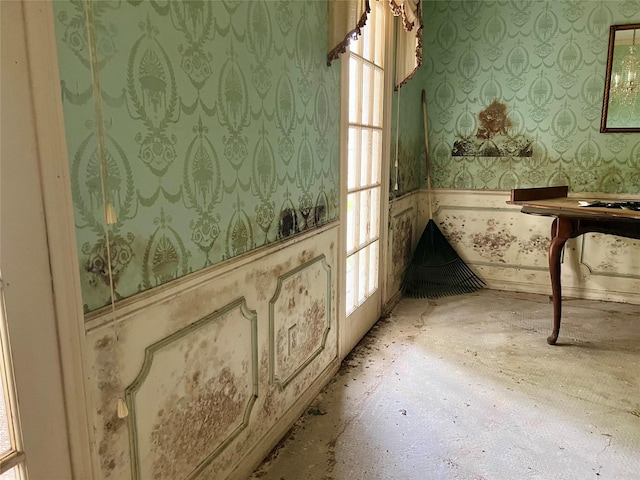 interior space with wallpapered walls