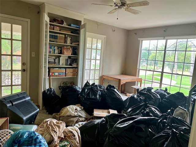 miscellaneous room with a ceiling fan and carpet flooring