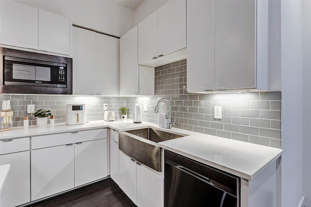 5841 Dolores St, Houston, TX 77057 - kitchen featuring built in microwave, dishwashing machine, a sink, and light countertops