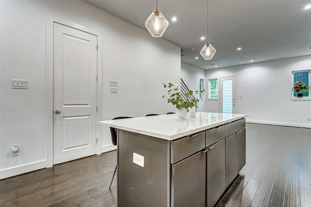 5841 Dolores St, Houston, TX 77057 - kitchen with dark wood finished floors, a kitchen island, recessed lighting, decorative light fixtures, and gray cabinetry