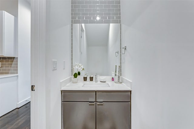 5841 Dolores St, Houston, TX 77057 - bathroom featuring wood finished floors, backsplash, and vanity