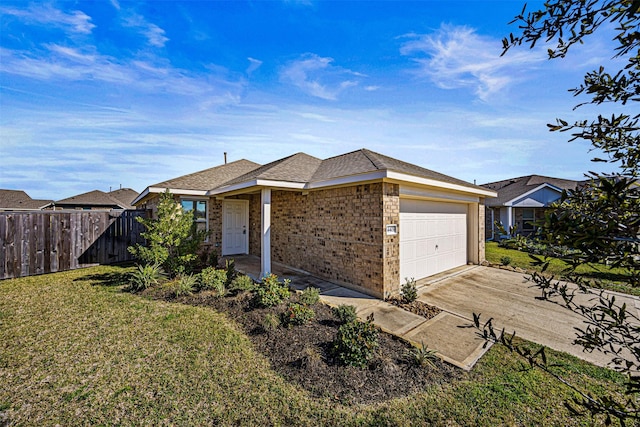 ranch-style home featuring fence, a front lawn, an attached garage, driveway, and brick siding