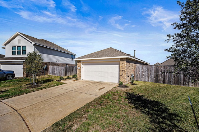 view of property exterior with a lawn, driveway, fence, a garage, and brick siding