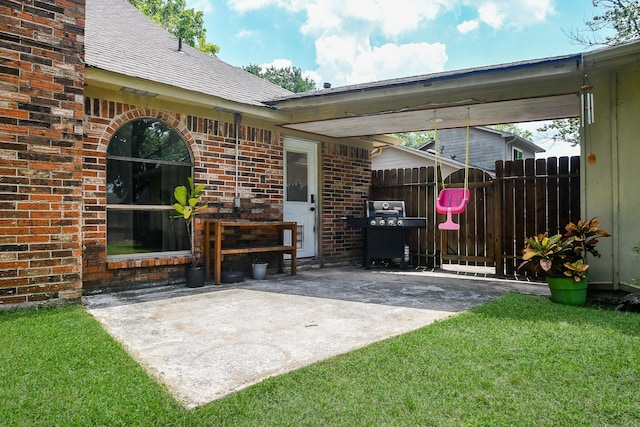 view of patio featuring fence and grilling area