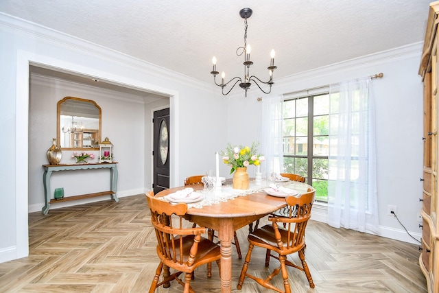 dining room featuring crown molding, a textured ceiling, baseboards, and a chandelier