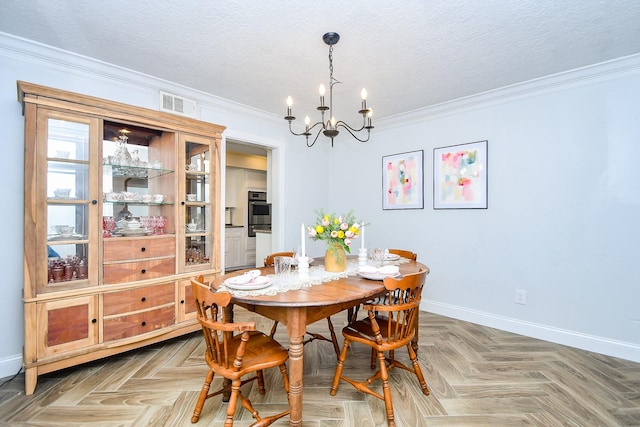 dining area featuring an inviting chandelier, baseboards, ornamental molding, and visible vents