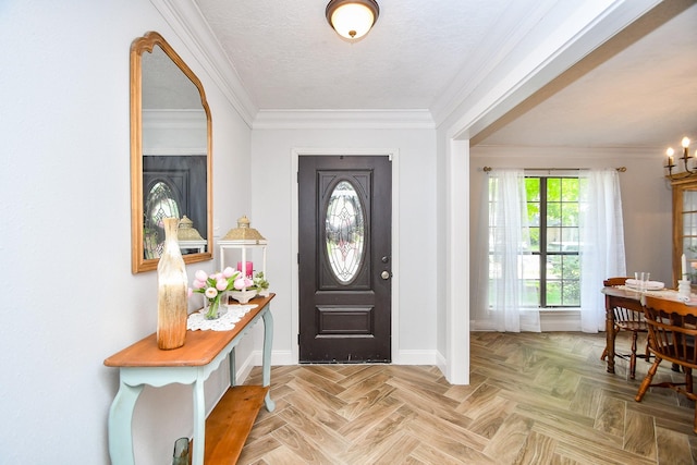 foyer entrance with baseboards and ornamental molding