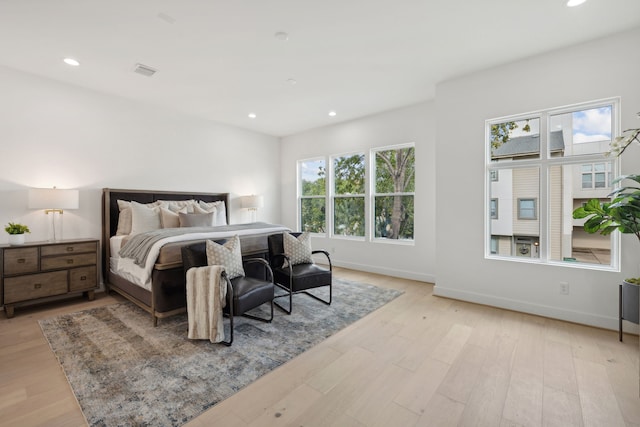 bedroom featuring light wood-style flooring, baseboards, and recessed lighting