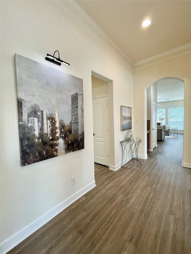 26936 Chateau Lake Dr, Kingwood, TX 77339 - corridor with arched walkways, wood finished floors, crown molding, and baseboards