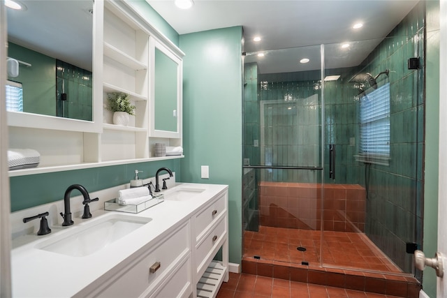 full bath featuring tile patterned flooring, a sink, a shower stall, and recessed lighting