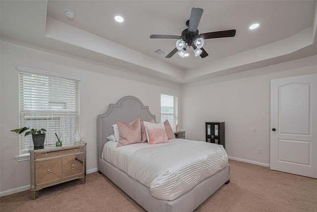 12205 Renewal Way, Houston, TX 77047 - carpeted bedroom with a tray ceiling, baseboards, recessed lighting, and ceiling fan
