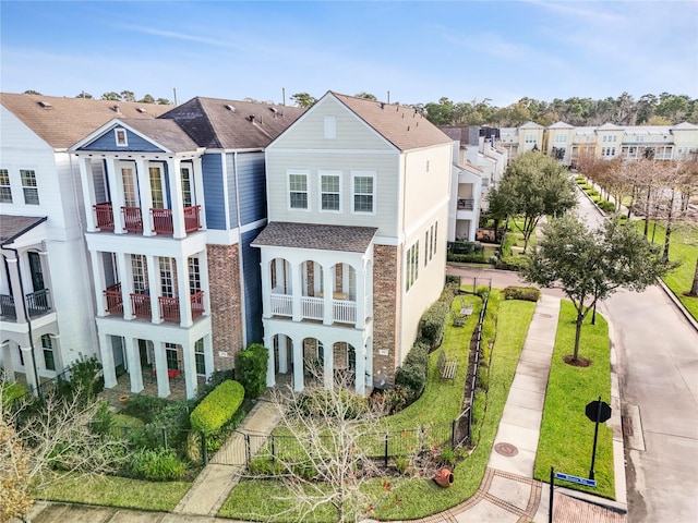 exterior space with a residential view and fence