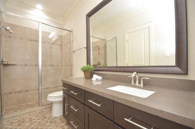 full bathroom with toilet, ornamental molding, vanity, and a stall shower