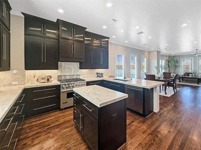 kitchen featuring a peninsula, light countertops, visible vents, and appliances with stainless steel finishes