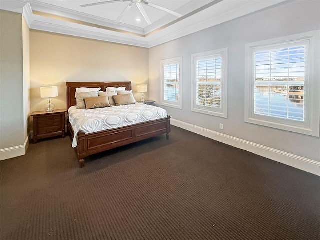 bedroom featuring baseboards, ornamental molding, and multiple windows