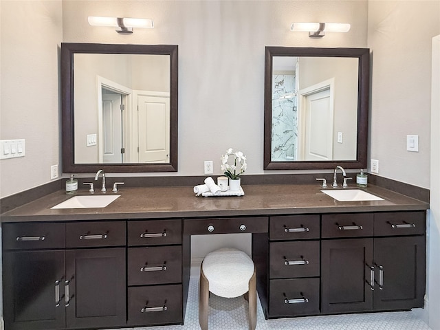 bathroom featuring a sink and double vanity
