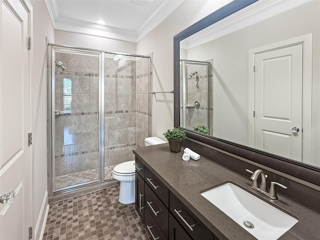 bathroom featuring toilet, a stall shower, vanity, and ornamental molding